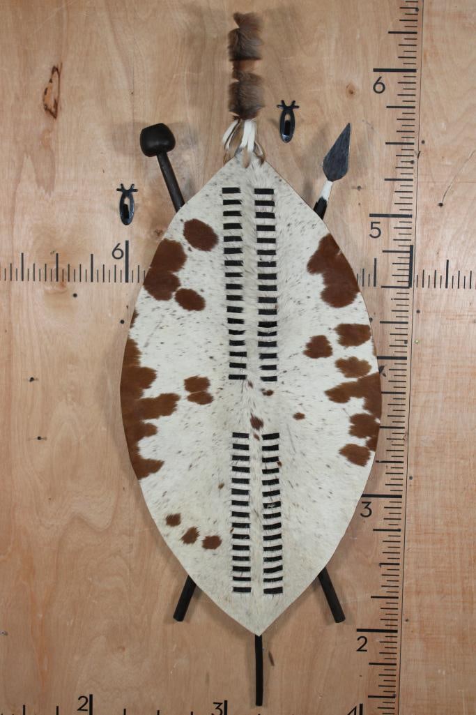Authentic African NGUNI Hide Shield from Zimbabwe: Authentic African NGUNI Cattle Hide Shield with a Club, Spear, and Staff. It measures 59" Tall x 22" Wide and is from Zimbabwe. COLLECTIBLE AFRICAN ARTIFACTS 