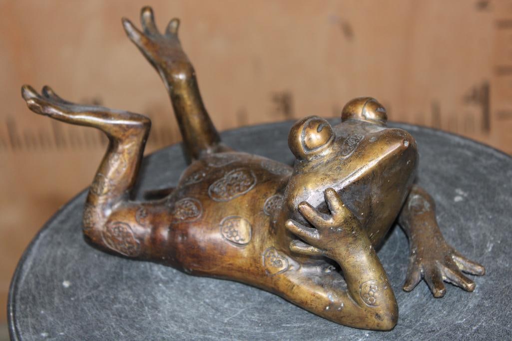 Resting Bronze FROG Fountain Sculpture, Weight: 4 lbs: Adorable Resting Bronze FROG Fountain. It measures 10" Long x 4" Tall x 5.5" Wide and the Total Weight is 4 lbs. When attached to a water source the Frog Bronze will spray a stream of water from its