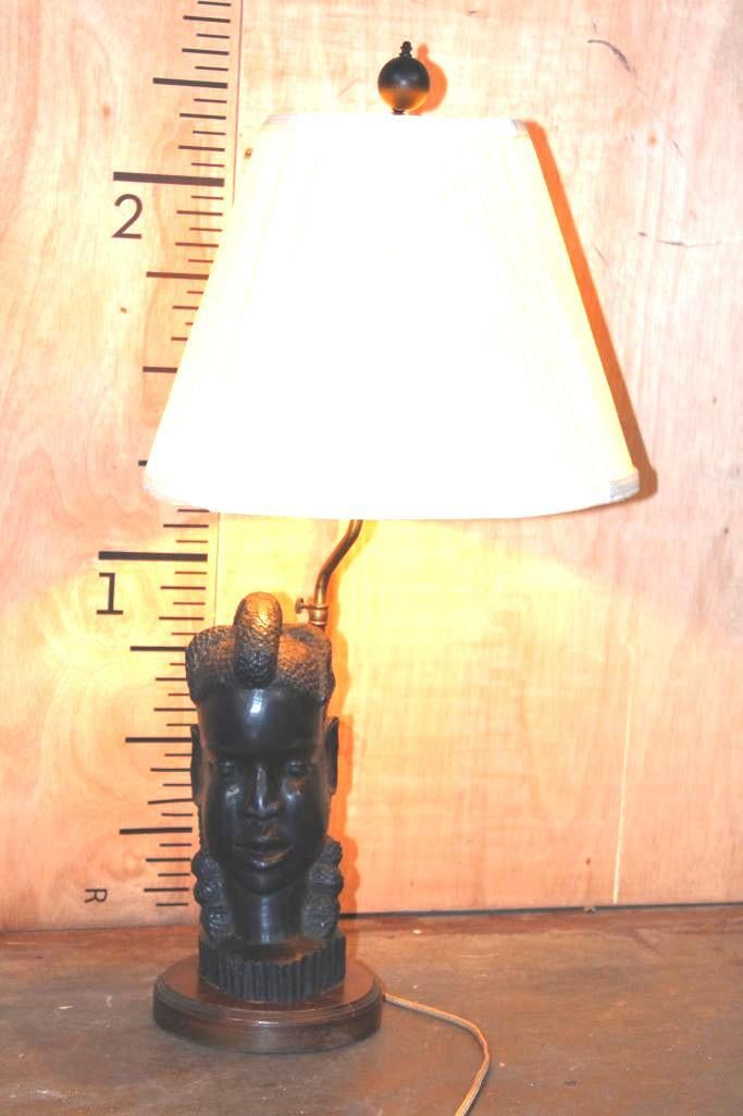 Vintage Hand-carved African Tribal Woman Bust LAMP: Hand-carved African Tribal Woman Bust LAMP. It is mounted on a wooden Base with a Brass Stand. It appears to be from the early to mid 20th Century due to the fabric wrapped chord and 2 (same size)