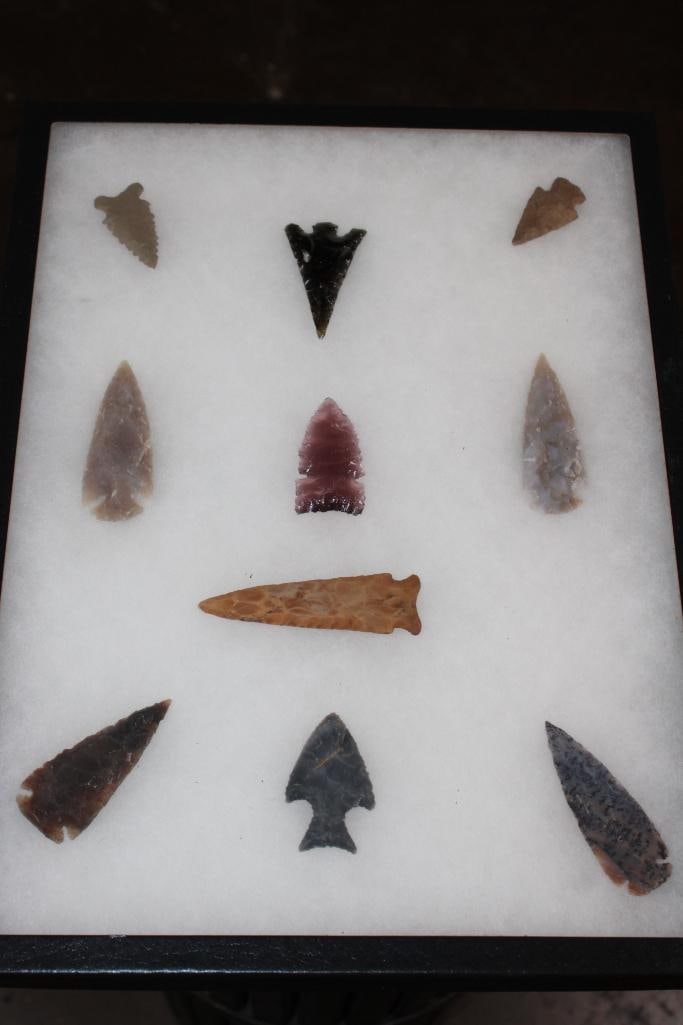 (10) Native American ARROWHEADS or Projectile Points in a Display Case: 10 Native American ARROWHEADS or Projectile Points. They are displayed in a Case with Glass that measures 12.25" Wide x 16.25" Long. There is an Andice, Ensor, an Elongated barbed arrowhead, a dovetai
