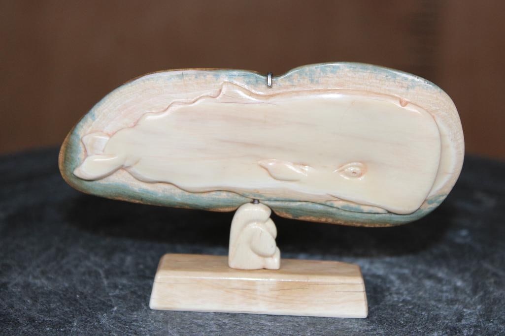 Guillermo Leal, Carved Fossilized MAMMOTH IVORY TUSK of a Whale: Fossilized MAMMOTH IVORY TUSK carved Whale with a Mammoth Tusk Ivory base. The mid section of the base shows a small Whale Tail. It measures 4.5" Long x 2.75" Tall x 5/8" Depth and Weighs 1 oz.