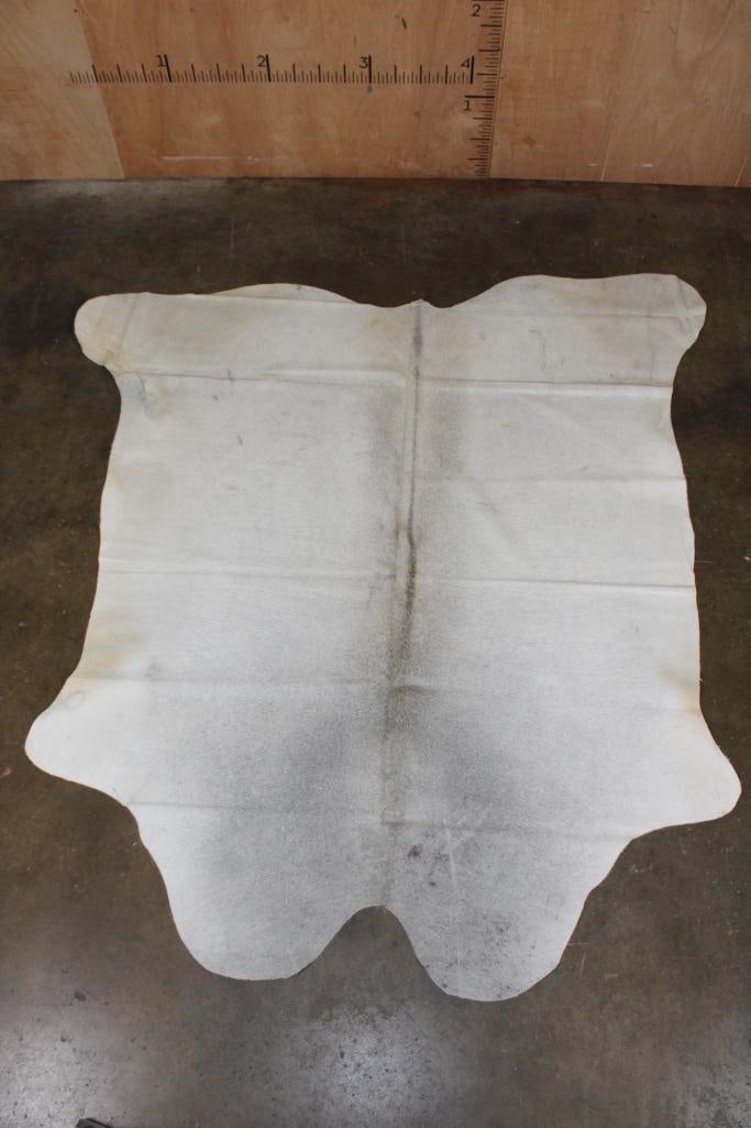 *Brand New* Grey COWHIDE or COWHIDE RUG: *Brand New* Grey COWHIDE or COWHIDE RUG. It measures 80" Long x 74.5" Wide and is made from 100% genuine Cowhide Leather. Cowhides are known for being durable, easy to clean, and hypoallergenic.