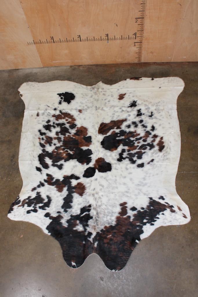 *Brand New* Tri-color COWHIDE or COWHIDE RUG: *Brand New* Tri-color COWHIDE or COWHIDE RUG. It measures 80" Long x 76" Wide and is made from 100% genuine Cowhide Leather. Cowhides are known for being durable, easy to clean, and