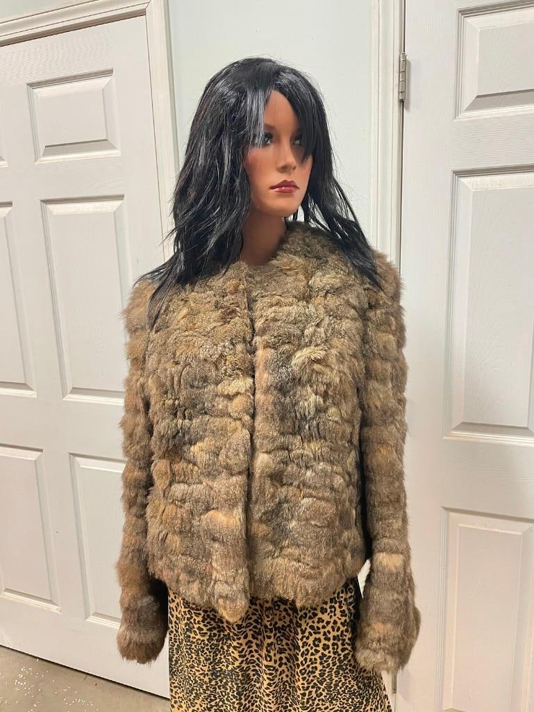 Australian Possum FUR COAT from Neiman-Marcus: Beautiful Australian Possum FUR COAT or FUR JACKET from Neiman-Marcus. It measures 22" Long and 15" across the back shoulders, the sleeves measure 26" Long each. This should fit like a size Medium.