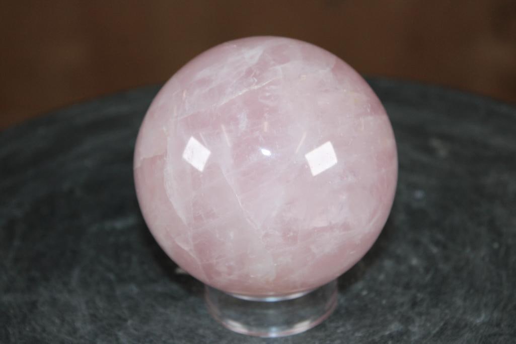 Polished ROSE QUARTZ Mineral Sphere, Weight: 1 lb: Formed and Polished ROSE QUARTZ Mineral Sphere. It measures 3.25" in Diameter and the Total Weight is 1 lb 13 oz. It comes with a plastic ring stand for display. Rose Quartz is known as the "love