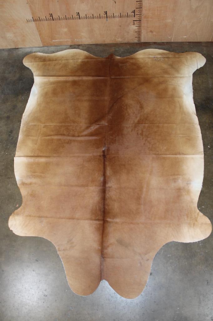 *Brand New* XL Natural Beige COWHIDE or COWHIDE RUG: *Brand New* XL Natural Beige COWHIDE or COWHIDE RUG. It measures 105" Long x 85" Wide and is made from 100% genuine Cowhide Leather. Cowhides are known for being durable, easy to clean, and