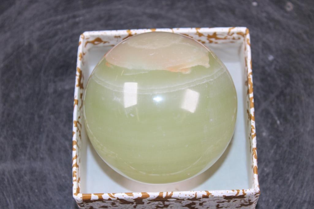 Polished GREEN BANDED ONYX Mineral Sphere, Weight: 1 lb: Formed and Polished GREEN BANDED ONYX Mineral Sphere. It measures 3" in Diameter and the Total Weight is 1 lb 7 oz. Green Banded Onyx is a stunning, translucent, and layered ornamental stone know for