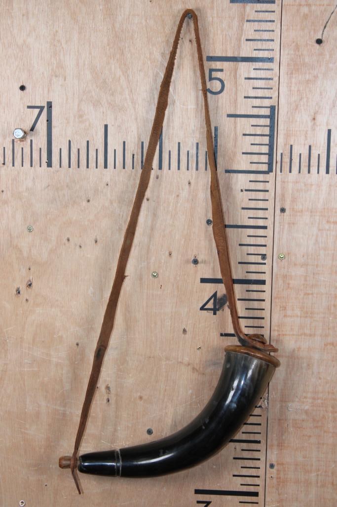 Polished POWDER HORN with a Leather Strap: Polished POWDER HORN with a Leather Strap. The Horn measures 14" Long around the curve and has a 3.5" Diameter. The Leather strap measures 45" Long and is removable. TAXIDERMY 