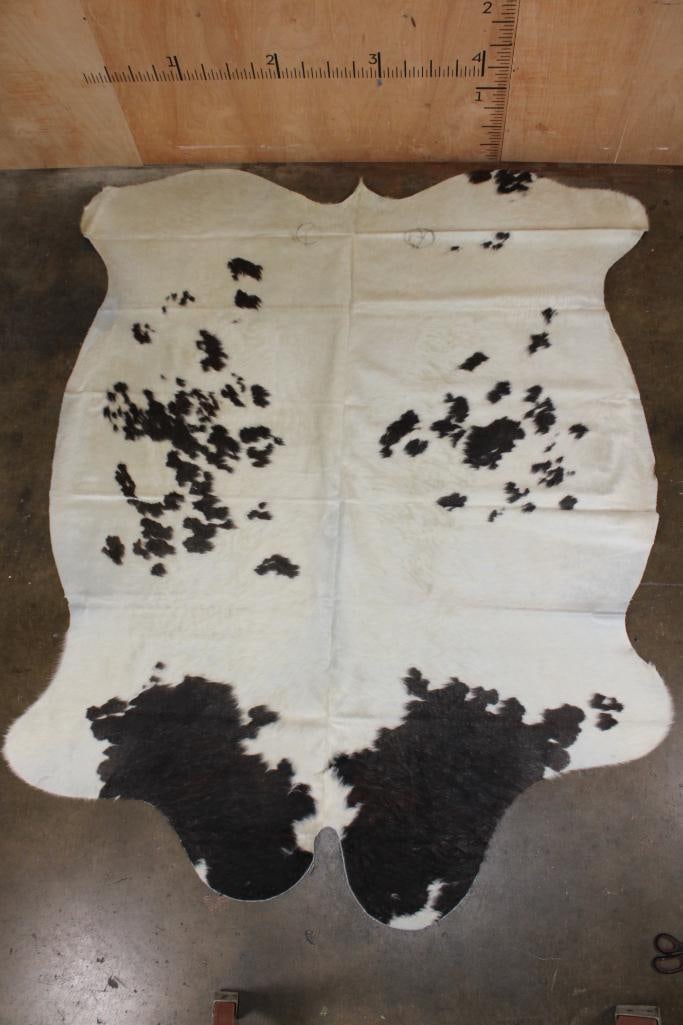 *Brand New* Black and White COWHIDE or COWHIDE RUG: *Brand New* Black and White COWHIDE or COWHIDE RUG. It measures 88" Long x 74" Wide and is made from 100% genuine Cowhide Leather. Cowhides are known for being durable, easy to clean, and