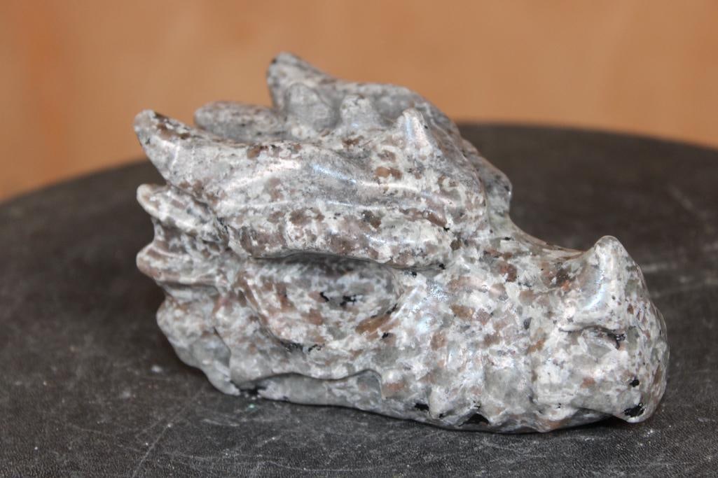 Hand-carved YOOPERLITE or "Flame Stone" Dragon Head that Glows under a UV Light!: Hand-carved YOOPERLITE or "Flame Stone" Dragon Head. It measures 4.5" Long x 3" Wide x 2.25" Tall and Weighs 1 lb 8 oz. Yooperlite is a type of fluorescent rock found along Lake Superior's shores in