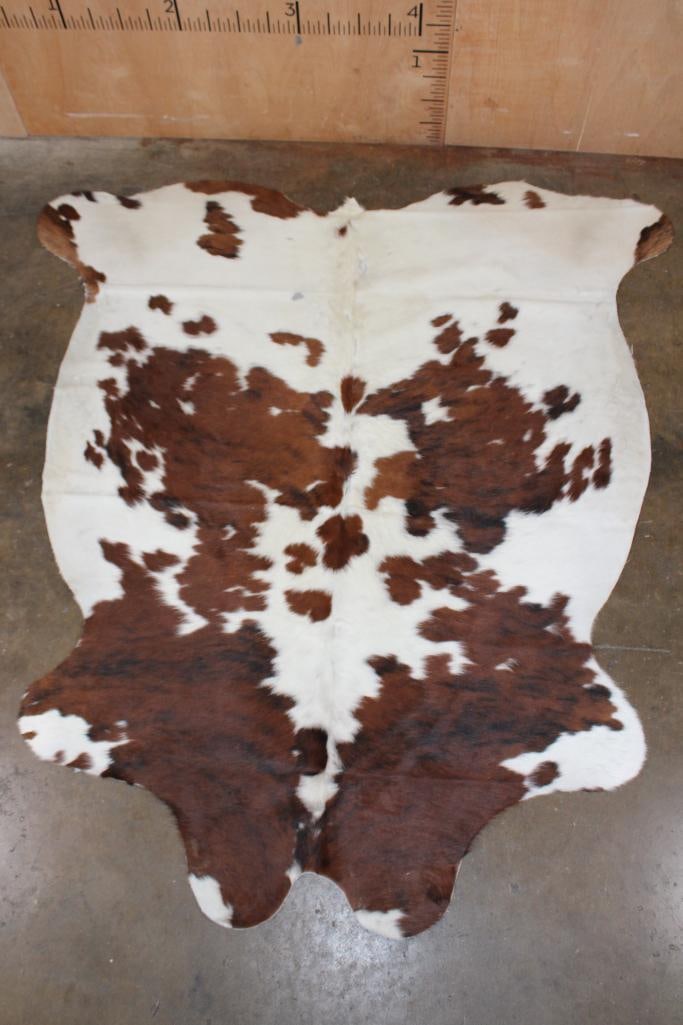 *Brand New* Tri-color COWHIDE or COWHIDE RUG: *Brand New* Tri-color COWHIDE or COWHIDE RUG. It measures 75" Long x 68" Wide and is made from 100% genuine Cowhide Leather. Cowhides are known for being durable, easy to clean, and