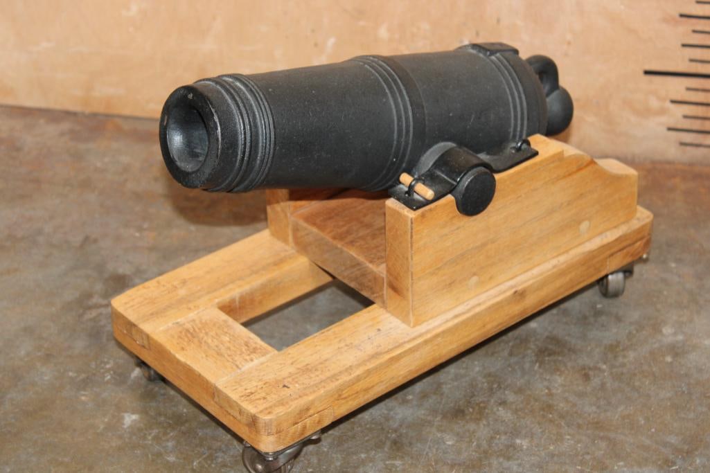 Model Cast Iron CARRONADE Naval CANNON on a Base with Wheels: Model Cast Iron CARRONADE Naval CANNON. These were used by the British Royal Navy between the late 18th and mid-19th centuries. They were often nicknamed the "ship smasher" and were designed for