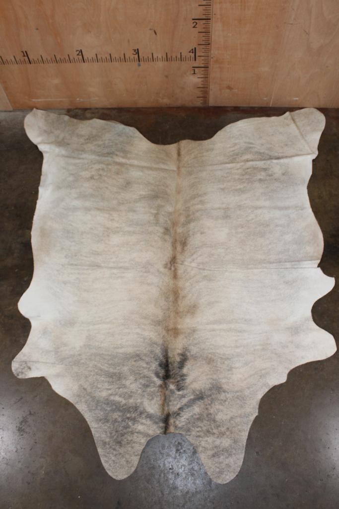 *Brand New* Beige and Grey COWHIDE or COWHIDE RUG: *Brand New* Beige and Grey COWHIDE or COWHIDE RUG. It measures 80" Long 72" Wide and is made from 100% genuine Cowhide Leather. Cowhides are known for being durable, easy to clean, and
