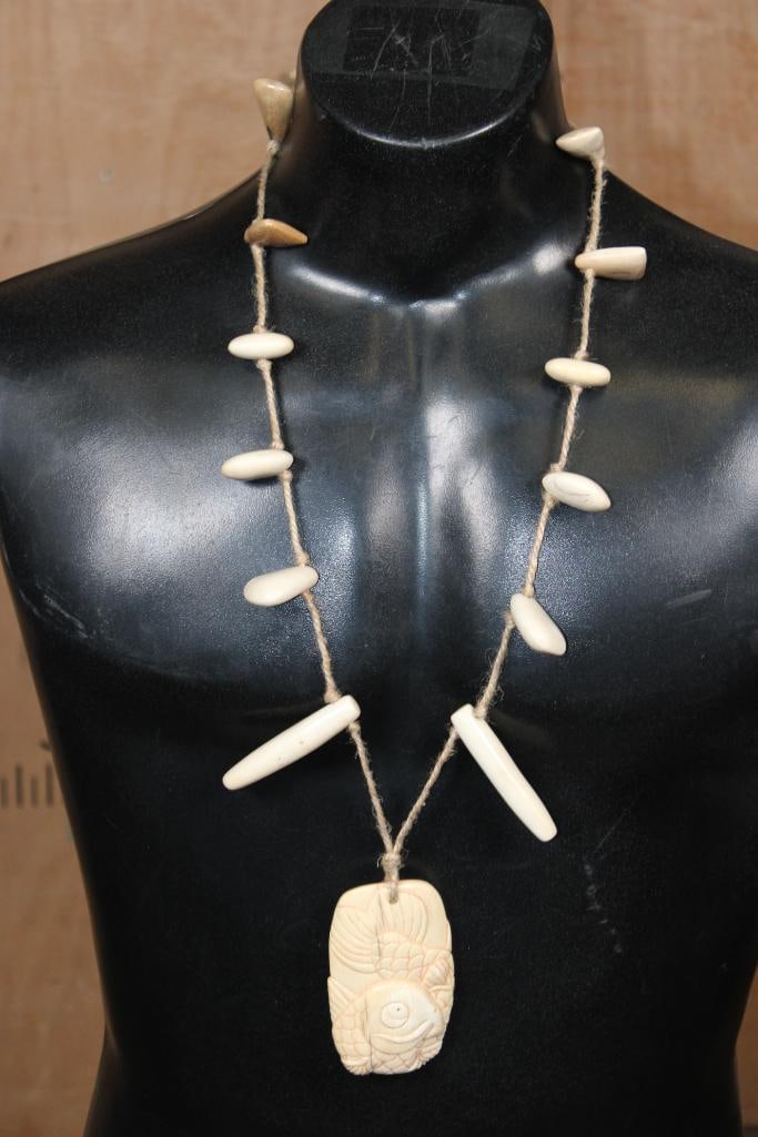 Guillermo Leal, Fossilized MAMMOTH IVORY TUSK Carved KOI or CARP Pendant with MAMMOTH IVORY BEADS: Guillermo Leal, Fossilized MAMMOTH IVORY TUSK Carved KOI or CARP Pendant Necklace with 13 Carved Fossilized Mammoth Tusk Beads. The Koi or Carp Pendant measures 4.75" Tall x 2.25" Wide x 1/2" Thick