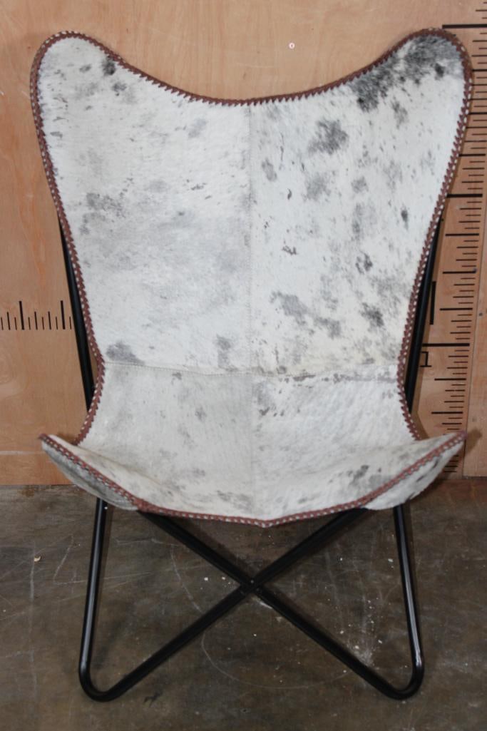 *Brand New* Grey COWHIDE CHAIR with a Black Metal Folding Frame: *Brand New* Grey COWHIDE Leather "Butterfly" CHAIR with a sling seat design and black metal frame. It measures 28" Long x 26" Wide x 38" Tall and is made from 100% genuine Cowhide Leather. It serves