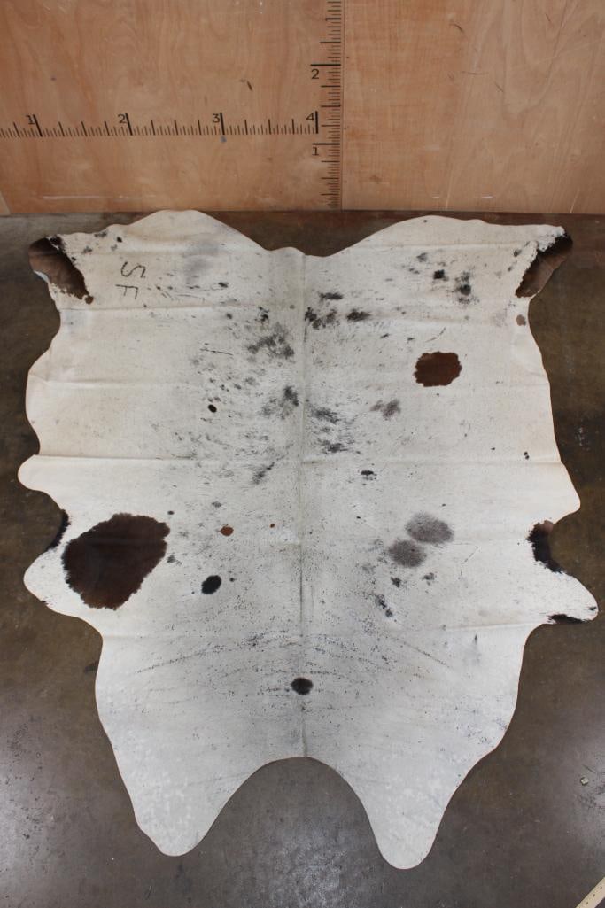 *Brand New* Speckled COWHIDE or COWHIDE RUG with a Brand: *Brand New* Speckled COWHIDE or COWHIDE RUG with a "SF" Brand! It measures 84" Long x 76" Wide and is made from 100% genuine Cowhide Leather. Cowhides are known for being durable, easy to clean,