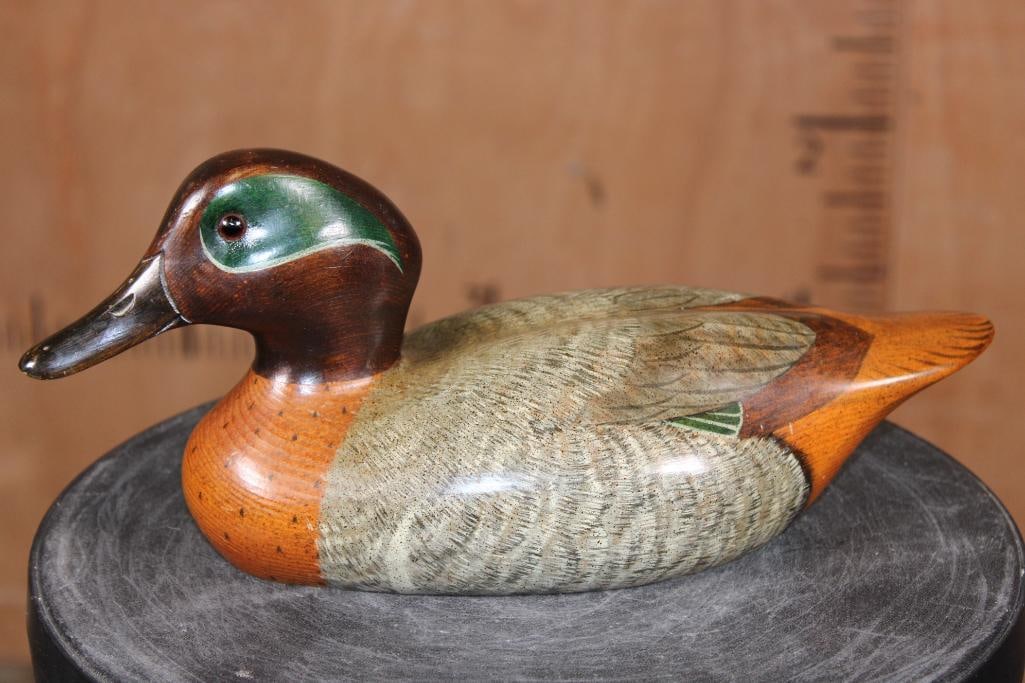 Hand-carved and Signed "Craig Dellaws" Wooden DUCK DECOY with Glass Eyes: Big Sky Carvers Bozeman, Montana hand-carved and Signed "Craig Dellaws" Green-winged Teal DUCK DECOY. It measures 13" Long x 5.5" Wide x 5.5" Tall and Weighs 1.6 lbs. COLLECTIBLE DUCK DECOYS 