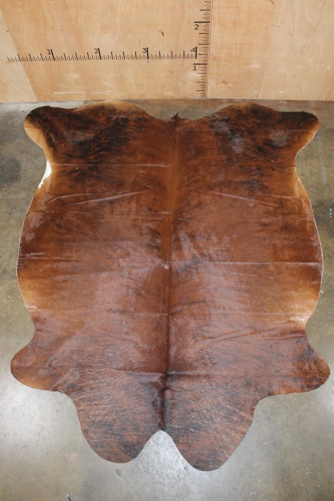 *Brand New* Brindle COWHIDE or COWHIDE RUG: *Brand New* Brindle COWHIDE or COWHIDE RUG. It measures 91" Long x 81" Wide and is made from 100% genuine Cowhide Leather. Cowhides are known for being durable, easy to clean, and hypoallergenic.