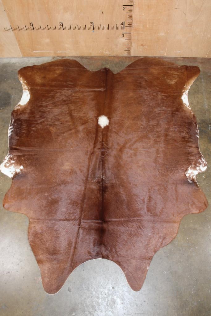 *Brand New* Brindle COWHIDE or COWHIDE RUG: *Brand New* Brindle COWHIDE or COWHIDE RUG. It measures 93" Long x 77" Wide and is made from 100% genuine Cowhide Leather. Cowhides are known for being durable, easy to clean, and hypoallergenic. They