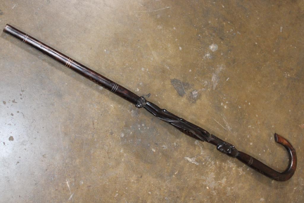 African Hardwood Hand-carved WALKING STICK or CANE: Beautiful Collectible African Hardwood Hand-carved WALKING STICK or CANE. It features a crook handle and intricate carvings along the shaft of an African warrior. It measures 35.75" Long. AFRICAN