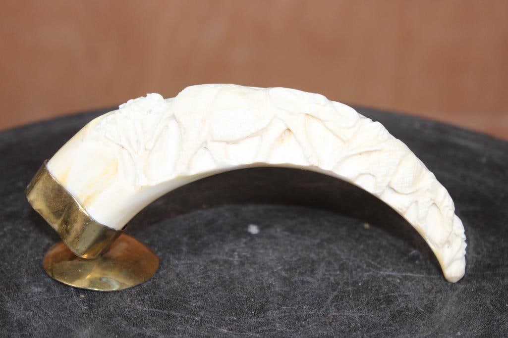 Scrimshawed WARTHOG TUSK with an Elephant Scene on a Brass Base: Beautiful Scrimshawed WARTHOG TUSK with an Elephant Scene. It has a Brass Base and is from Zimbabwe. It measures 6" Long x 1.75" Wide x 3" Tall. DECORATIVE TAXIDERMY 