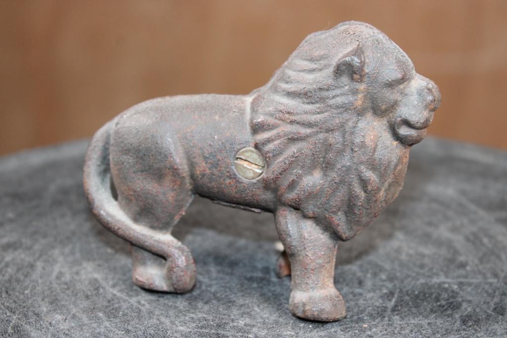 Antique Cast Iron LION Still Bank by the A.C. Williams Company: Antique (early 1900s) Cast Iron LION Still Bank by the A.C. Williams Company. It measures 4.25" Long x 1.75" Wide x 3.25" Tall and Weighs 14 oz. It is a "still bank" meaning it has no moving parts for