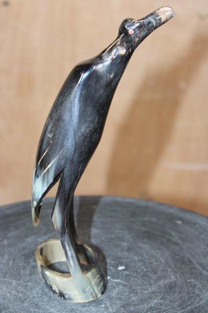 Hand-carved and Polished Steer Horn BIRD Sculpture from Africa: Hand-carved and Polished Steer Horn BIRD Sculpture from Africa. It depicts a crane or heron and measures 9.25" Tall. These sculptures are associated with the mid-century. COLLECTIBLE AFRICAN