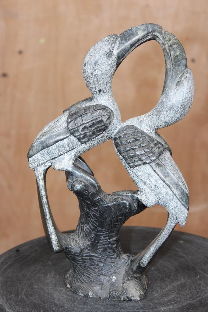 Hand-carved African Serpentine Stone SCULPTURE from Zimbabwe: Hand-carved African Serpentine Stone SCULPTURE. This was made by the Shoan people from Zimbabwe. It depicts a pair of "lovebirds", likely hornbills. It measures 11" Tall x 6.5" Long x 3" Wide and