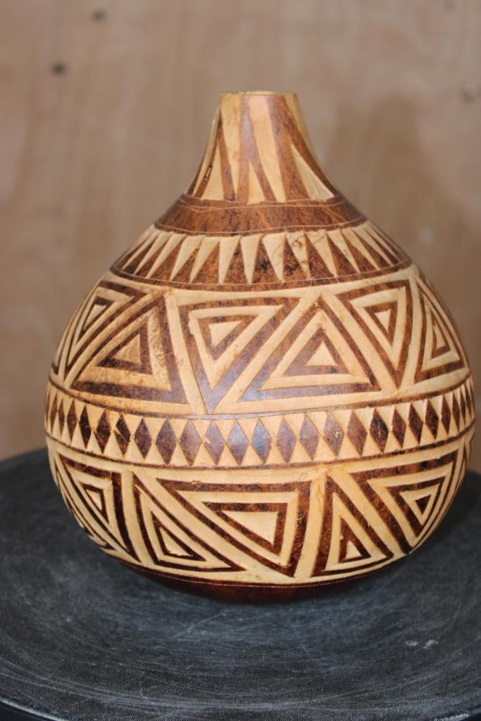 Decorative African CALABASH GOURD: Ornamental African CALABASH GOURD. It measures 8.5" Tall x 7" Diameter at the Base. These gourds are handcrafted, featuring intricate carvings, engravings or pyrography (burning designs) that create