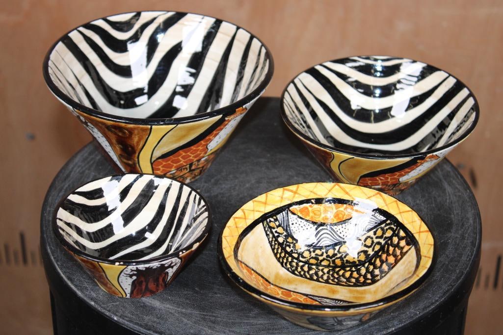 (4) Hand-painted Ceramic Bowls from Zimbabwe created by artist Miriam for Nivex Africa: 4 Hand-painted Ceramic Nesting Bowls from Zimbabwe. They created by artist Miriam for the brand Nivex Africa and are signed. The measure Largest to smallest 3 3/8" Tall x 6 5/8" Diameter, 2.5" Tall x