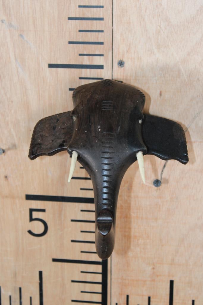 Hand-carved African Ebony Wood ELEPHANT Head Sculpture: Hand-carved African Ebony Wood ELEPHANT Head Sculpture or Wall Hanging Art. It measures 7.75" Tall x 6.25" Wide x 3.25" Depth. COLLECTIBLE AFRICAN ART 