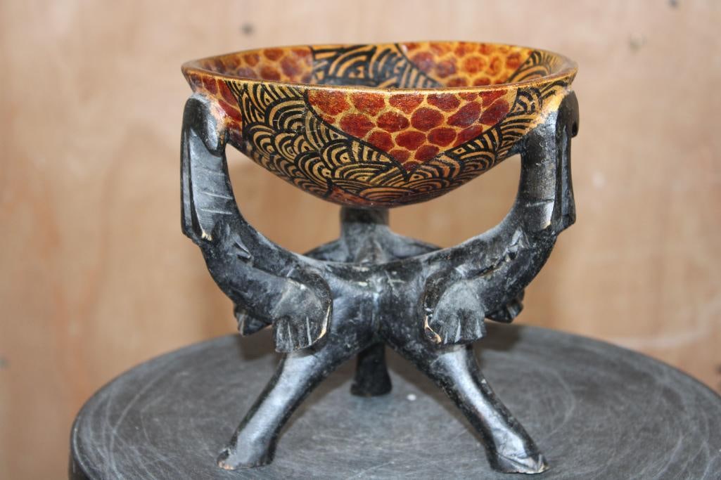 African Hand-carved Wood BOWL with 3 Elephant Tripod Base: Hand-carved African Wood BOWL with 3 Elephant Tripod Base. It has been painted with a tribal design and measures 7" Tall x 6.75" in Diameter (at the Bowl), Weighs 13 oz. COLLECTIBLE AFRICAN ART 