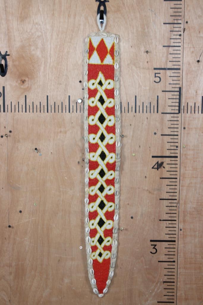 African YORUBA Beaded Sash or Panel with Cowrie Shells from Nigeria: African YORUBA Beaded Sash or Panel with Cowrie Shells. It was crafted from the Yoruba people of Nigeria. These sashes are significant ritual items, often worn by Ifa diviners (Babalawo) or