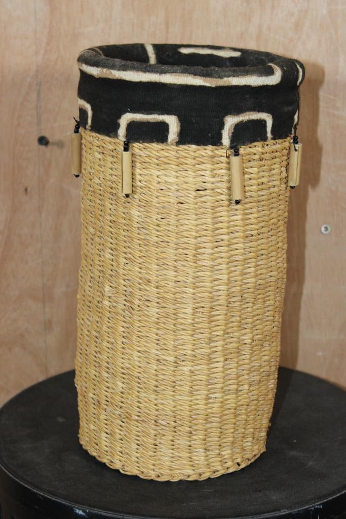 Hand-woven African BASKET made from Wicker with Wood Beads and Fabric Accents: Decorative African Hand-woven BASKET made from Wicker. It is embellished with African textile fabric, wood beads, seed beads and fabric accents. It measures 12.25" Tall x 6.25" in Diameter.