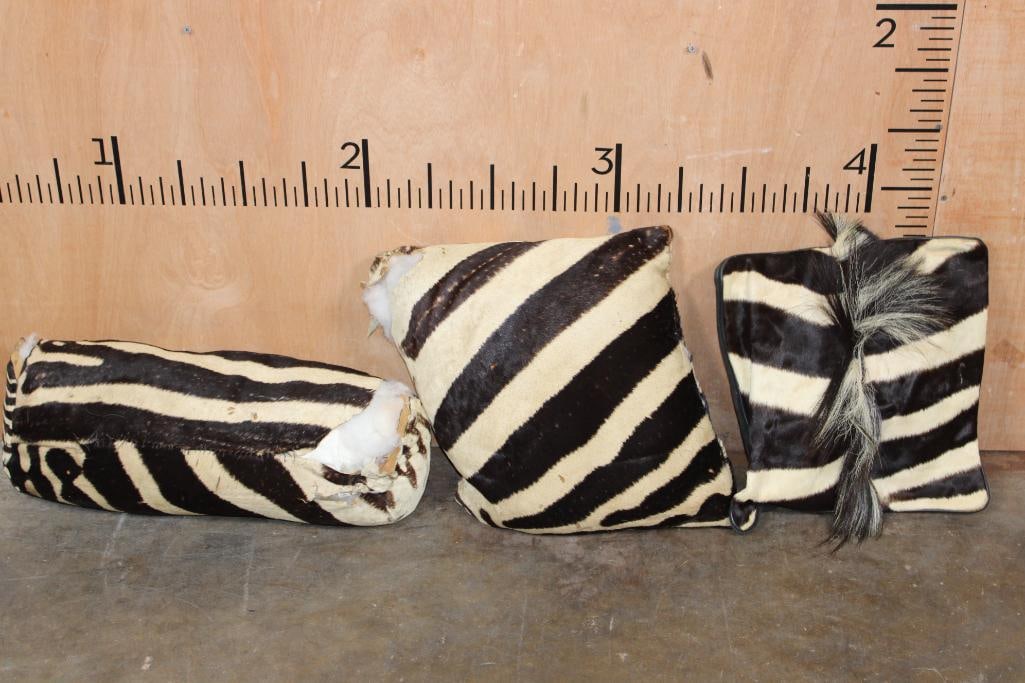 (3) ZEBRA Hide PILLOWS: 3 ZEBRA Hide PILLOWS. The Left 2 have damage and dry rot. DECORATIVE TAXIDERMY PILLOWS 