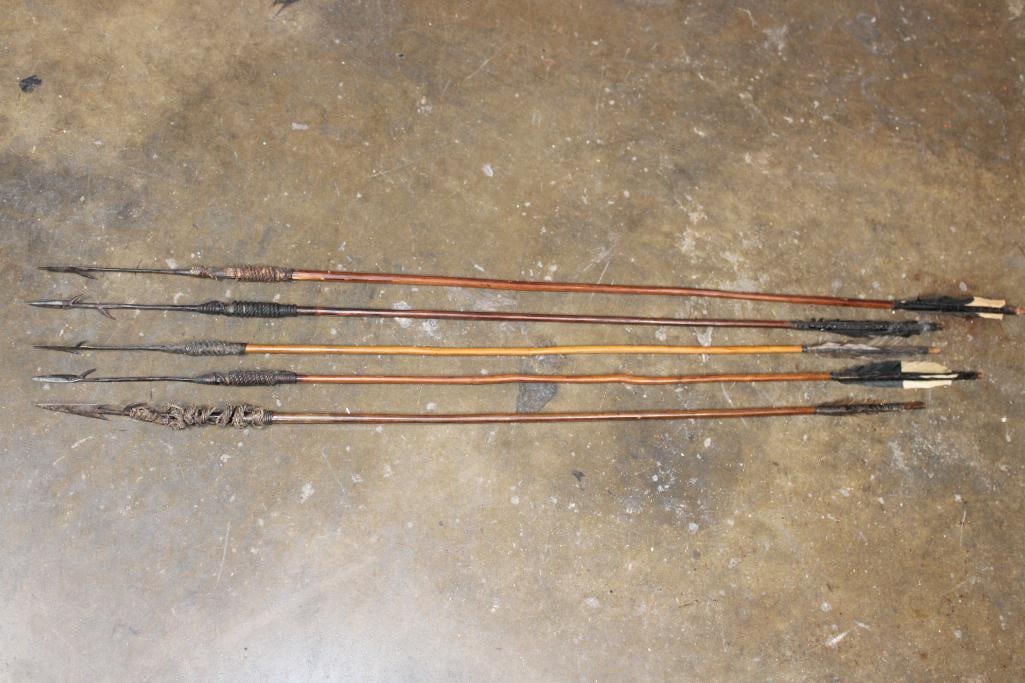 (5) Authentic African Tribal ARROWS with Barbed Tips: 5 Authentic African Tribal ARROWS with Barbed Tips and Feather fletching. These were traditionally used for hunting game or fishing. They measure 38" to 44" Long each. The Next Lot: 705 is an Afr