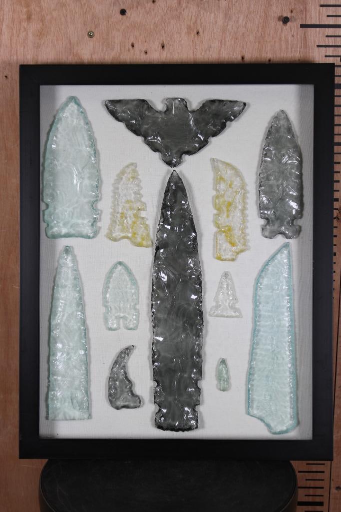 (11) Hand-knapped Glass Projectile Points with (1) Glass Eagle in a Shadowbox Frame: 11 Hand-knapped Glass Projectile Points or Arrowheads with 1 Glass Eagle. They are displayed in a Shadowbox Frame with a hinged glass lid. It measures 20" Long x 16" Wide x 2" Thick. NATIVE