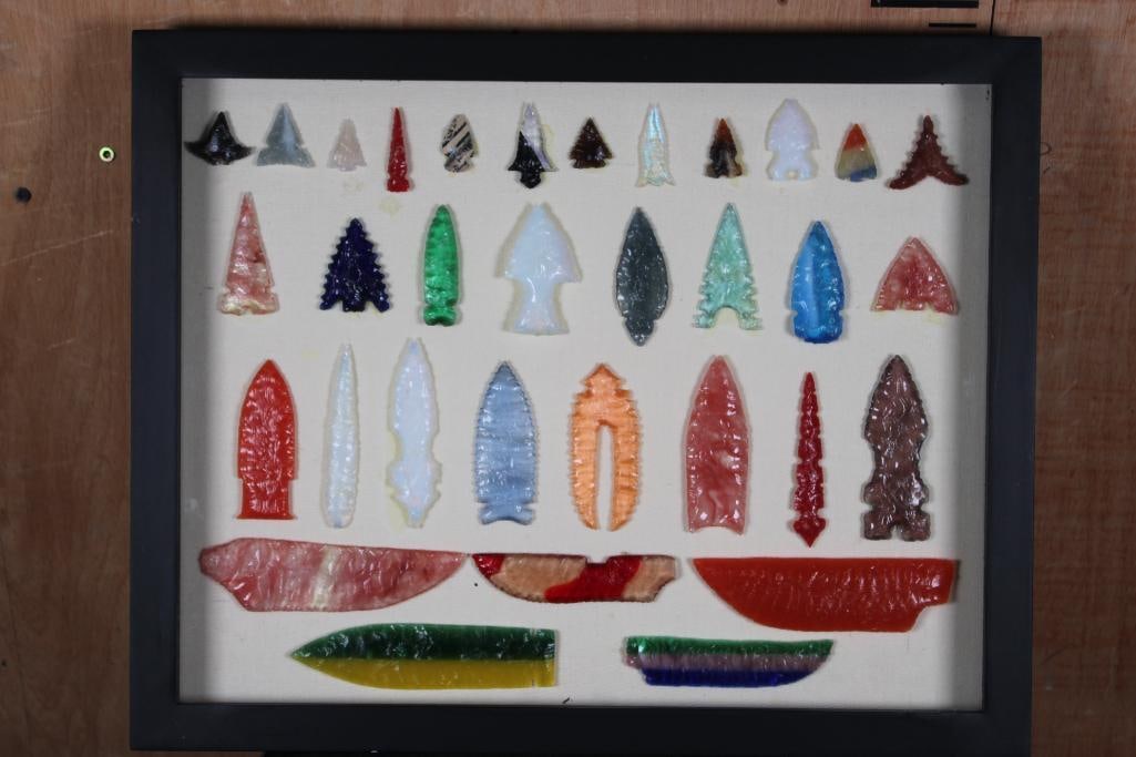 (33) Colorful Hand-knapped Native American Style Glass ARROWHEADS or Projectile Points in a: 33 Colorful Hand-knapped Native American Style Glass and Mineral ARROWHEADS or Projectile Points. They are displayed in a Shadowbox Frame with a hinged lid that measures 20" Long x 16" Wide x 2"