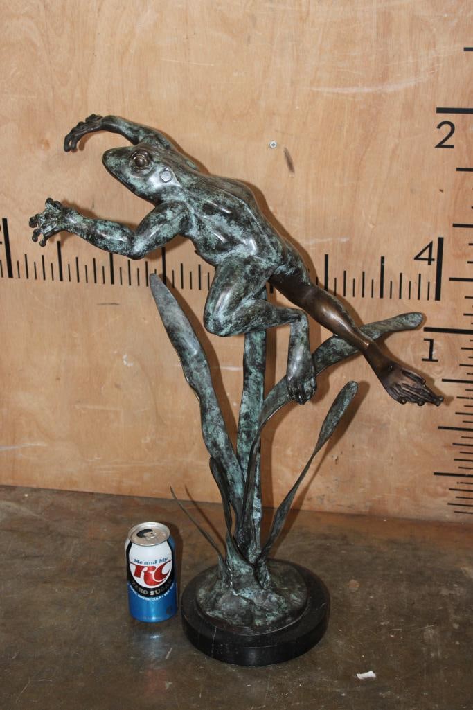 Big Bronze "Frog Jumping over Grass" Sculpture on a Marble Base: Big Bronze "Frog Jumping over Grass" Sculpture on a Marble Base. It measures 25" Tall x 19" Long x 11" wide and Weighs 17.5 lbs. It could be used for Outdoor or Indoor use. COLLECTIBLE BRONZE SCULPTUR
