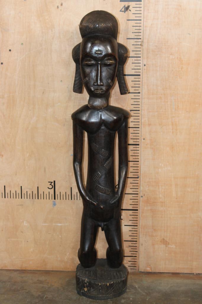 Hand-carved Baule "Blolo Bian" Male African Wood Sculpture from the Ivory Coast: Hand-carved Baule "Blolo Bian" (Spirit Spouse) African hardwood figure Sculpture from the Ivory Coast. It measures 47" Tall x 10" Wide x 10" Tall and Weighs 28 lbs 3 oz. The Next Lot (542) is the