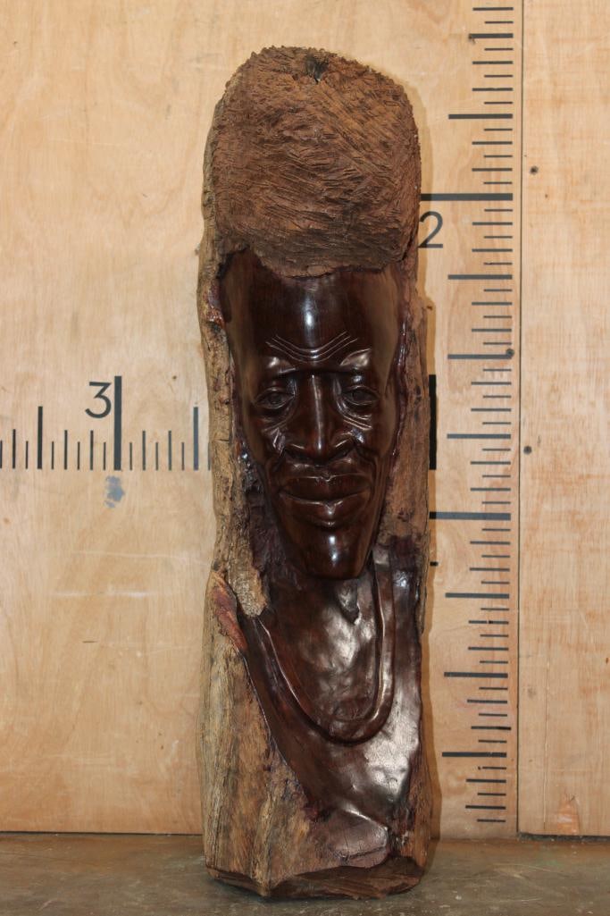 Hand-carved Makonde Tribe Elder Bust from East Africa: East African Makonde root wood Elder Bust. It is hand-carved from a single block of dense African Hardwood, likely ebony or ironwood. It was carved by the Makonde Tribe originating from Mozambique