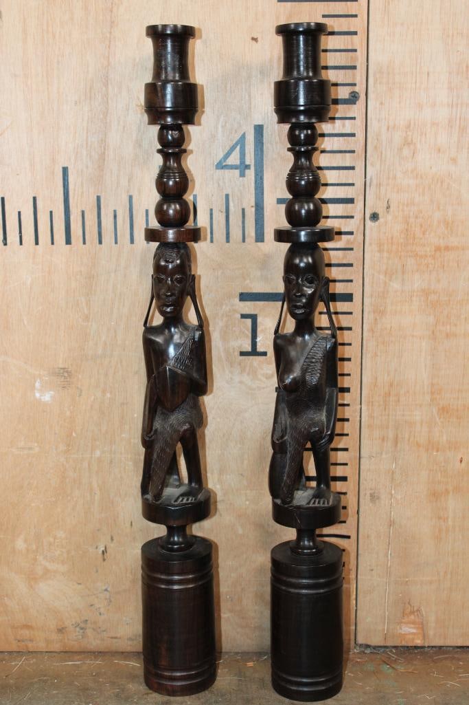 Vintage Pair of Hand-carved Ebony Wood Kenyan CANDLESTICKS Featuring a Man and a Woman: Vintage Pair of Hand-carved Ebony Wood Kenyan CANDLESTICKS Featuring a Man and a Woman. They measure 20.5" Tall x 2.5" Wide. COLLECTIBLE AFRICAN ARTIFACTS 