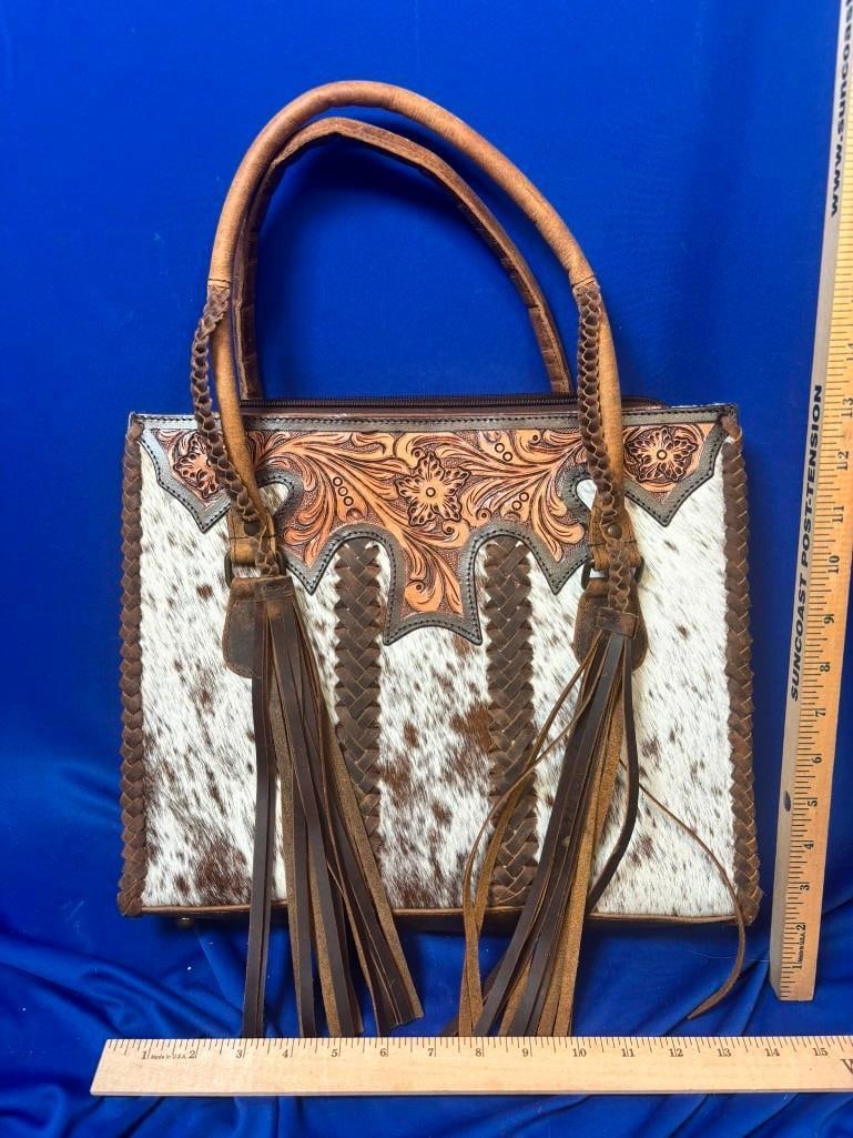 *Brand New* Western Style Cowhide and Tooled Leather PURSE with Fringe: *Brand New* Western Style Cowhide and Tooled Leather PURSE with Leather Fringe. It measures 14" Tall x 14" Wide x 4" Depth. TAXIDERMY LEATHER HANDBAGS AND PURSES
