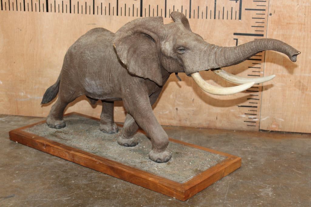 Big Elephant SCULPTURE by Louis Paul (Jonas Studios), #1266 and Hand signed: Big Elephant SCULPTURE. It is hand signed "Louis Paul Jonas Studios and Numbered #1266. It measures 32.5" Long x 14" Wide x 16" Tall. One of the Tusks has a repair, otherwise it is in Good Condition.