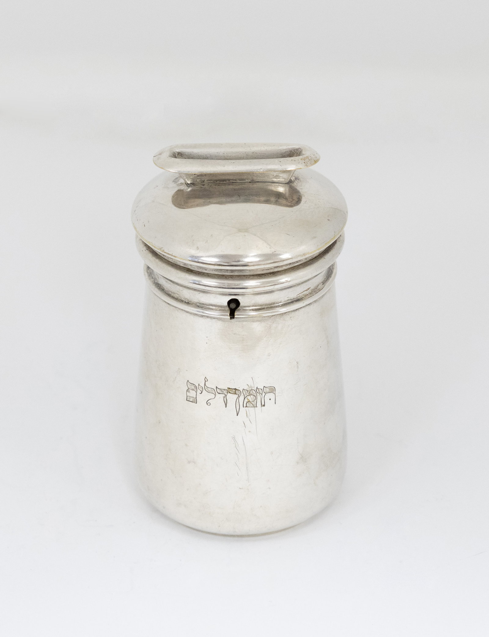 Silver-Plated Charity Box. Hungary, 19th Century: 'Tzeddakah Pushke' for collecting mobey for charity with a Hebrew engraving from the period with the Hebrew words 'Tomech Dalim'. The Sages instituted that in every city with a Jewish community,