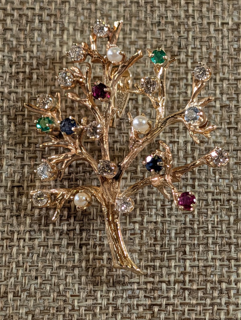 14K Ladies Vintage Yellow Gold Tree Brooch and Pendant: 14K Ladies Vintage Yellow Gold Tree Brooch and Pendant Appointed with Diamonds, Emeralds, Rubies and Aquamarine. Weighs 10.1 grams Beautiful 2 in. length Width 1 7/8 in.