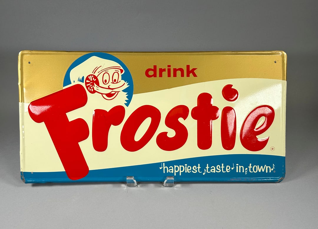 Frostie Vintage Pressed Tin Sign "The Happiest Taste In Town": Frostie Vintage Pressed Tin Sign "The Happiest Taste In Town" Excellent Condition for age.