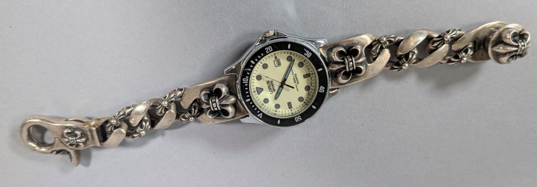 Chrome Hearts Style Sterling Silver Watch Band on Lorus Watch: Chrome Hearts Style Sterling Silver Watch Band on Lorus Watch. Very Heavy, Wear consistent with age. Pictures are considered part of the description.