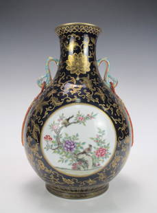 A Chinese Gilted Blue Glaze Famille Rose Flowers and Birds Porcelain Vase: A Chinese Gilted Blue Glaze Famille Rose Flowers and Birds Porcelain Vase, Qing Dynasty with Qianlong Mrak, Size: 38*27cm.