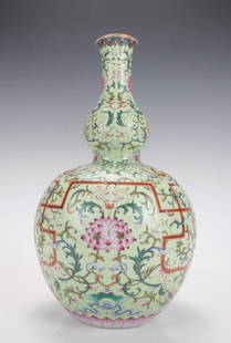 A Chinese Gilted Famille Rose Lotus Porcelain Gourd Vase: A Chinese Gilted Famille Rose Lotus Porcelain Gourd Vase, Qing Dynasty with Qianlong Mark, Size: 40*23cm.